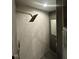 Modern bathroom shower with tiled walls and sleek fixtures at 5809 Iris Lake Ct, Raleigh, NC 27604