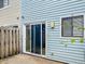 Backyard featuring a sliding glass door, privacy fence and blue siding at 5810 Shady Grove Cir, Raleigh, NC 27609