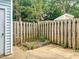 Fenced backyard with minimal landscaping and access to an outdoor shed at 5810 Shady Grove Cir, Raleigh, NC 27609