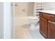 Bright bathroom with tile flooring, a white toilet, and a shower/tub combo at 5810 Shady Grove Cir, Raleigh, NC 27609