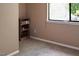 Bedroom with carpet flooring, a window, and a wooden shoe rack at 5810 Shady Grove Cir, Raleigh, NC 27609