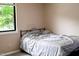Bedroom featuring a window with natural light and a simple metal bed frame at 5810 Shady Grove Cir, Raleigh, NC 27609