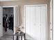 Bedroom with an open closet, housing dark clothes on hangers at 5810 Shady Grove Cir, Raleigh, NC 27609