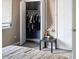 Bedroom with an open closet, housing dark clothes on hangers at 5810 Shady Grove Cir, Raleigh, NC 27609