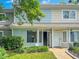 Charming townhome exterior featuring well-manicured landscaping and a welcoming entryway at 5810 Shady Grove Cir, Raleigh, NC 27609
