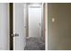 Hallway with doors and carpet at 5810 Shady Grove Cir, Raleigh, NC 27609