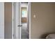 Hallway leading to a bedroom with natural light at 5810 Shady Grove Cir, Raleigh, NC 27609