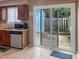 Cozy kitchen with a view to the backyard through sliding glass doors at 5810 Shady Grove Cir, Raleigh, NC 27609