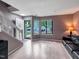 Bright living room featuring hardwood floors, large windows, and an open floor plan at 5810 Shady Grove Cir, Raleigh, NC 27609