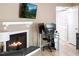 Inviting living room area with a fireplace and workspace at 5810 Shady Grove Cir, Raleigh, NC 27609