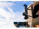 The House Bar & Eatery Sign is eye-catching against the brick building and bright sky, with inviting exterior lighting at 6422 Tanner Oak Ln, Raleigh, NC 27613