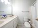 Bathroom featuring double sinks, marble countertops, and a shower-tub combo at 6501 Battleford Dr, Raleigh, NC 27613