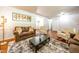 Cozy living area with hardwood floors, comfortable furnishings, stylish decor, and an open layout at 6501 Battleford Dr, Raleigh, NC 27613
