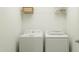 Clean laundry room with a white washer, dryer, and wire shelving for storage at 66 Digging Time Ave, Princeton, NC 27569