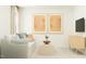 Cozy living room with sofa, neutral decor, and natural light from window at 66 Digging Time Ave, Princeton, NC 27569