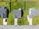 An aerial rooftop view of a home with a fenced backyard and mature trees and landscaping at 737 Botanical Ct, Bunnlevel, NC 28323