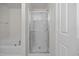 Bathroom with separate soaking tub and glass-enclosed shower offers a spa-like experience in the comfort of home at 737 Botanical Ct, Bunnlevel, NC 28323