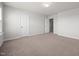 This carpeted bedroom features a double door closet, offering ample storage space and functional design at 737 Botanical Ct, Bunnlevel, NC 28323