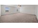 Spacious bedroom with dual windows and a ceiling fan, offering both light and comfort for a relaxing retreat at 737 Botanical Ct, Bunnlevel, NC 28323