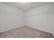 Spacious walk-in closet features carpeted floor, wire shelving for optimal storage, and freshly painted neutral colored walls at 737 Botanical Ct, Bunnlevel, NC 28323