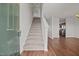 Welcoming foyer features hardwood floors and a staircase leading to the upper level of the home at 737 Botanical Ct, Bunnlevel, NC 28323