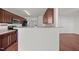 A functional kitchen features wood cabinets, stainless steel appliances, and durable countertops at 737 Botanical Ct, Bunnlevel, NC 28323