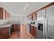 A functional kitchen features wood cabinets, stainless steel appliances, and durable countertops at 737 Botanical Ct, Bunnlevel, NC 28323