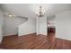Inviting living room featuring hardwood floors with staircase and kitchen access at 737 Botanical Ct, Bunnlevel, NC 28323