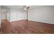 Spacious living room features hardwood floors, two closets, ceiling fan, and ample natural light at 737 Botanical Ct, Bunnlevel, NC 28323