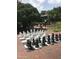Outdoor community chess with full-size pieces offers entertainment and relaxation at 807 W Trinity Ave # 209, Durham, NC 27701