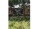 Pearl Mill Flats brick sign with lush landscaping offers a welcoming entrance to the community at 807 W Trinity Ave # 209, Durham, NC 27701