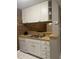 Compact kitchen boasts white cabinets, ample counter space, and essential appliances for cooking at 807 W Trinity Ave # 209, Durham, NC 27701