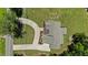 Aerial shot of home showcasing a winding driveway, mature landscaping, and outdoor patio at 8420 Bells Lake Rd, Apex, NC 27539