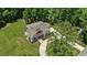 Aerial view of a charming home surrounded by a well manicured lawn and mature trees at 8420 Bells Lake Rd, Apex, NC 27539