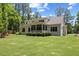Expansive backyard featuring lush green grass and an outdoor patio at 8420 Bells Lake Rd, Apex, NC 27539