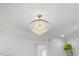 Luxurious bathroom with elegant hanging crystal lighting and pristine white walls at 8420 Bells Lake Rd, Apex, NC 27539