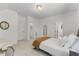 Cozy bedroom with carpet, queen size bed, and natural light at 8420 Bells Lake Rd, Apex, NC 27539