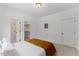 Bright bedroom featuring a walk-in closet and ensuite bathroom at 8420 Bells Lake Rd, Apex, NC 27539