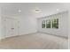 Spacious bedroom features recessed lighting, large windows, and plush carpeting at 8420 Bells Lake Rd, Apex, NC 27539
