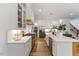 Bright kitchen with a large island, white cabinets, and stainless steel appliances at 8420 Bells Lake Rd, Apex, NC 27539