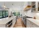 Bright open kitchen featuring stainless steel appliances and a large island at 8420 Bells Lake Rd, Apex, NC 27539