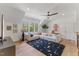Bright living area with vaulted ceilings, white walls, hardwood floors, and oversized windows at 8420 Bells Lake Rd, Apex, NC 27539