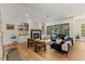 Living room features a fireplace, hardwood floors, and access to the outdoor deck at 8420 Bells Lake Rd, Apex, NC 27539
