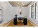 Office with contemporary desk, neutral walls, built-in shelving, and a stylish chandelier at 8420 Bells Lake Rd, Apex, NC 27539