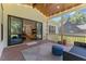 Bright screened porch featuring wood ceilings, gray rug, and access to the home's interior at 8420 Bells Lake Rd, Apex, NC 27539