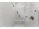 Sleek walk-in shower featuring a bench and marble style tile at 8420 Bells Lake Rd, Apex, NC 27539