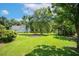 Expansive backyard with mature trees and a well-maintained lawn at 86 Basswood Cir, Willow Springs, NC 27592