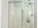 Glass shower with modern rain style shower head and seating at 86 Basswood Cir, Willow Springs, NC 27592