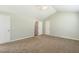 View of a bedroom with carpet, neutral paint and 2 doors at 86 Basswood Cir, Willow Springs, NC 27592