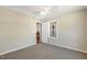 Bedroom featuring plush carpeting and a door leading to a hallway at 86 Basswood Cir, Willow Springs, NC 27592